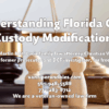 Photograph of gavel in family law court with figurines of a family and family law attorney photograph with words relating to Florida law of child custody modification